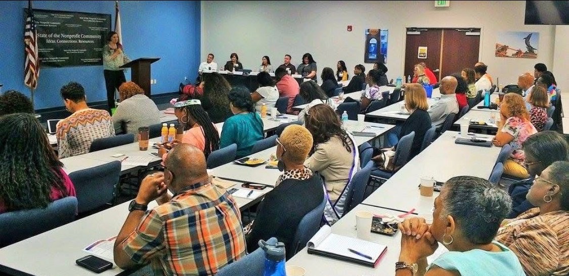 Full room of nonprofit leaders seated at a past SONC summit